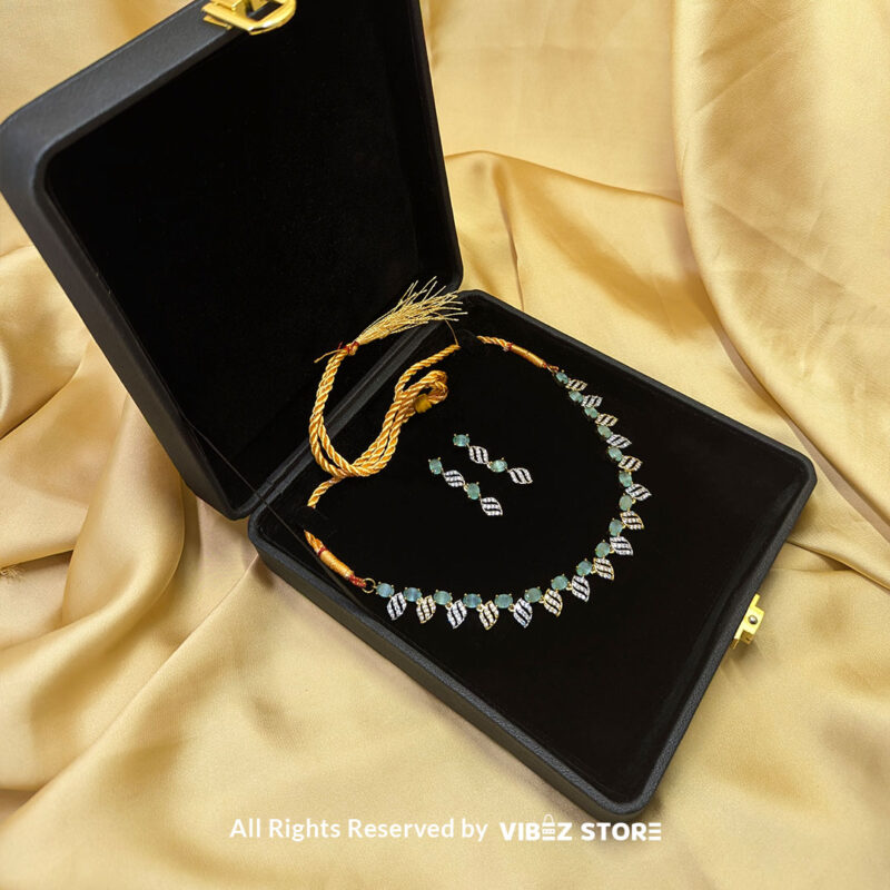 Mint Green Leaf Necklace & Earring Set Gold-Tone Crystal Jewelry 3 Mint Green Leaf Necklace and Earring Set with gold-tone settings, mint green gemstones, and leaf-shaped crystal designs from VibezStore