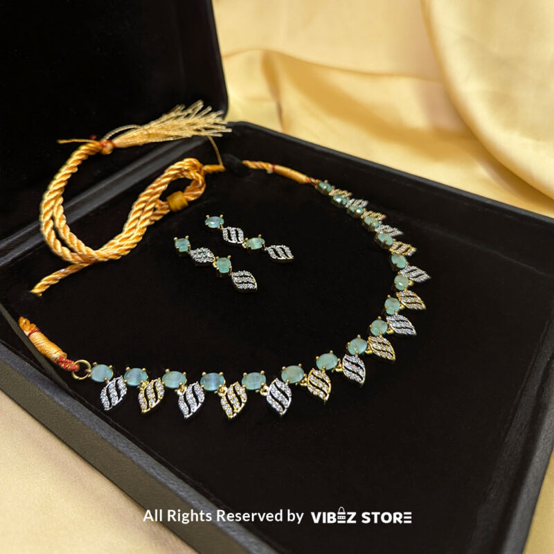 Mint Green Leaf Necklace & Earring Set Gold-Tone Crystal Jewelry 2 Mint Green Leaf Necklace and Earring Set with gold-tone settings, mint green gemstones, and leaf-shaped crystal designs from VibezStore