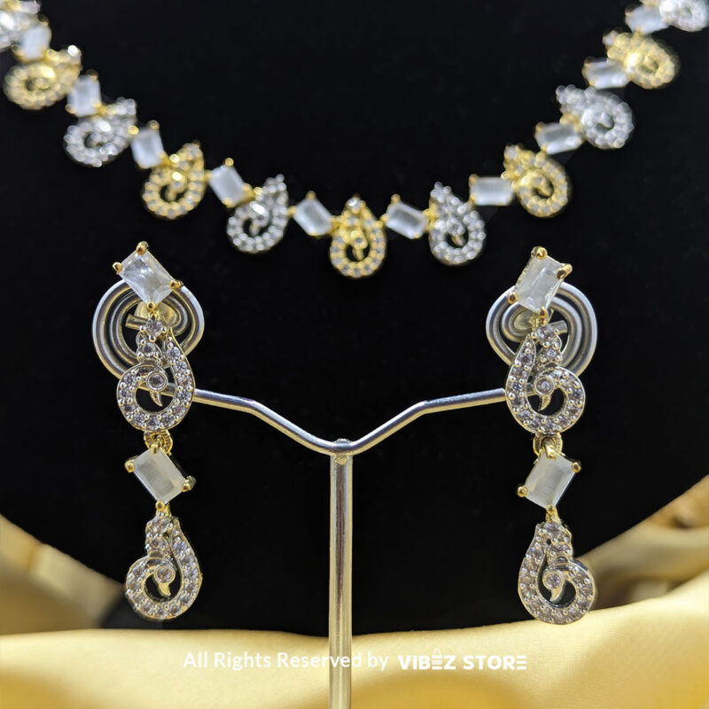 Crystal Swirl Statement Necklace Gold-Tone & White Gemstone Jewelry 5 Crystal Swirl Necklace and Earring Set with gold-tone accents and crystal swirl designs from VibezStore