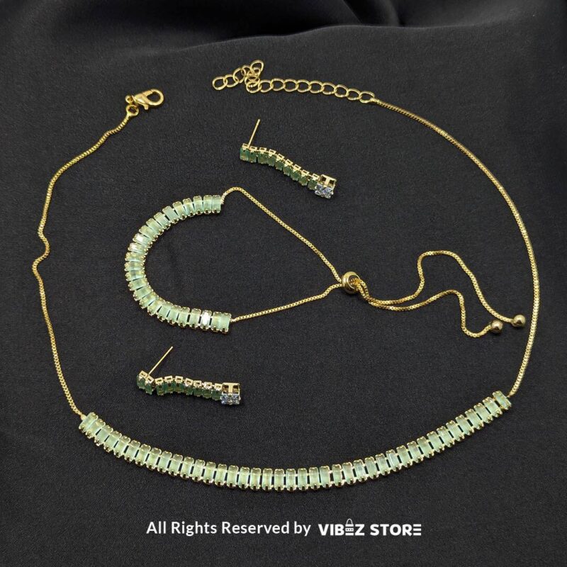 Mint Green Crystal Jewelry Set 1 Mint green crystal jewelry set with a necklace, bracelet, ring, and earrings featuring baguette-style crystals.