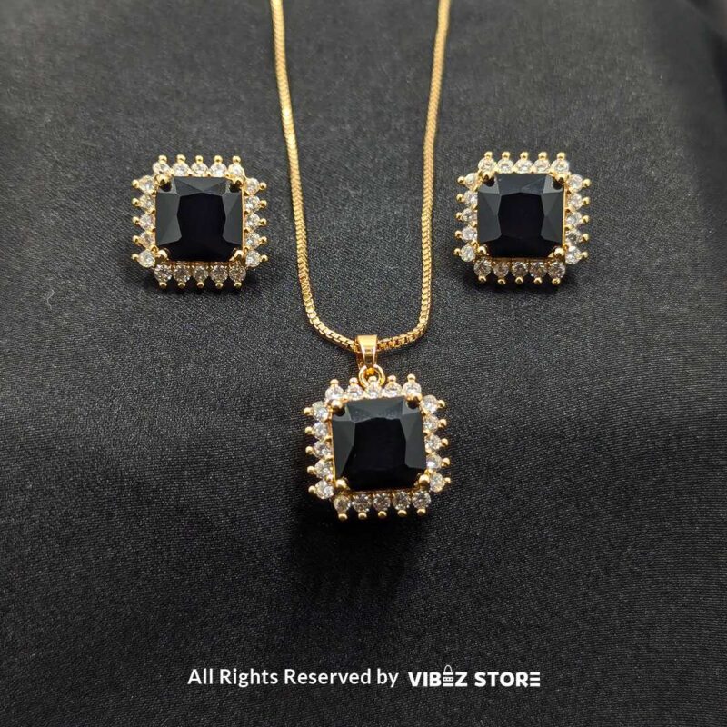 Black Square Pendant Jewelry Set 1 Black square pendant jewelry set featuring a necklace with a gold chain and matching stud earrings adorned with cubic zirconia.