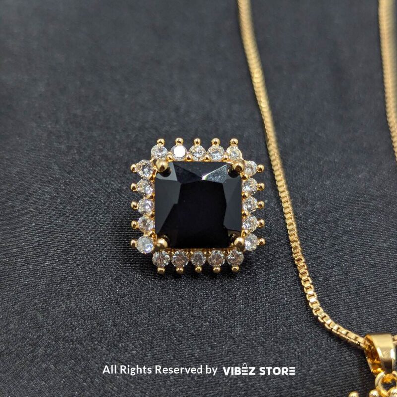 Black Square Pendant Jewelry Set 3 Black square pendant jewelry set featuring a necklace with a gold chain and matching stud earrings adorned with cubic zirconia.