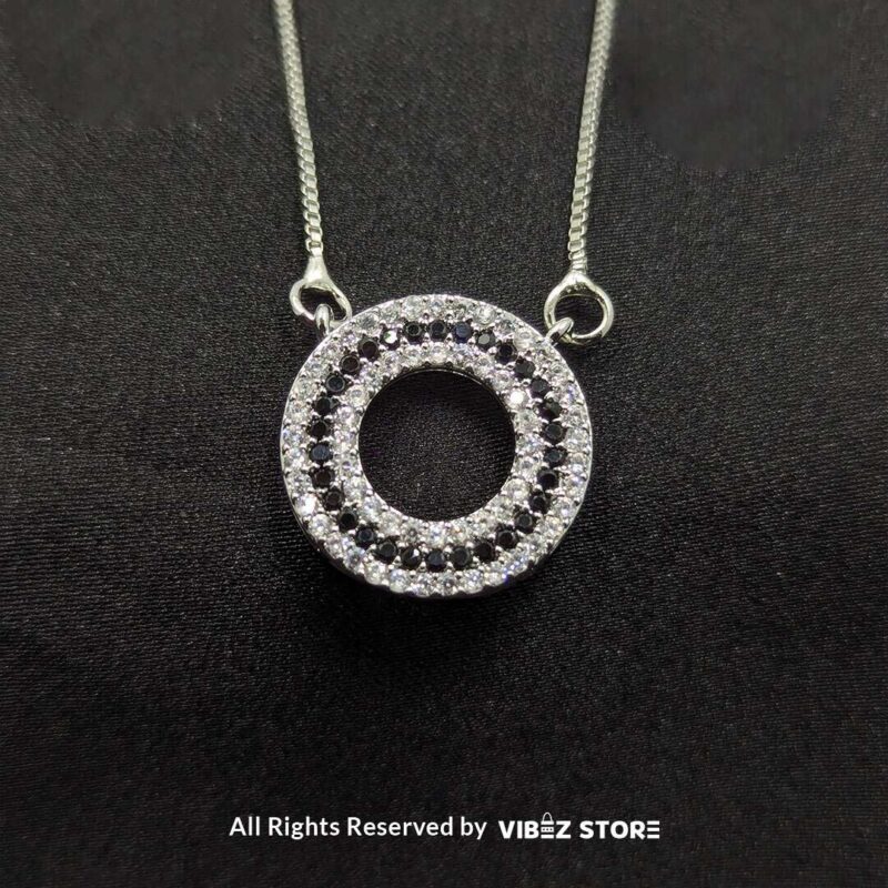 Silver Round Pendant Jewelry Set 3 Silver round pendant jewelry set with a delicate chain necklace and matching circular stud earrings, adorned with cubic zirconia stones.