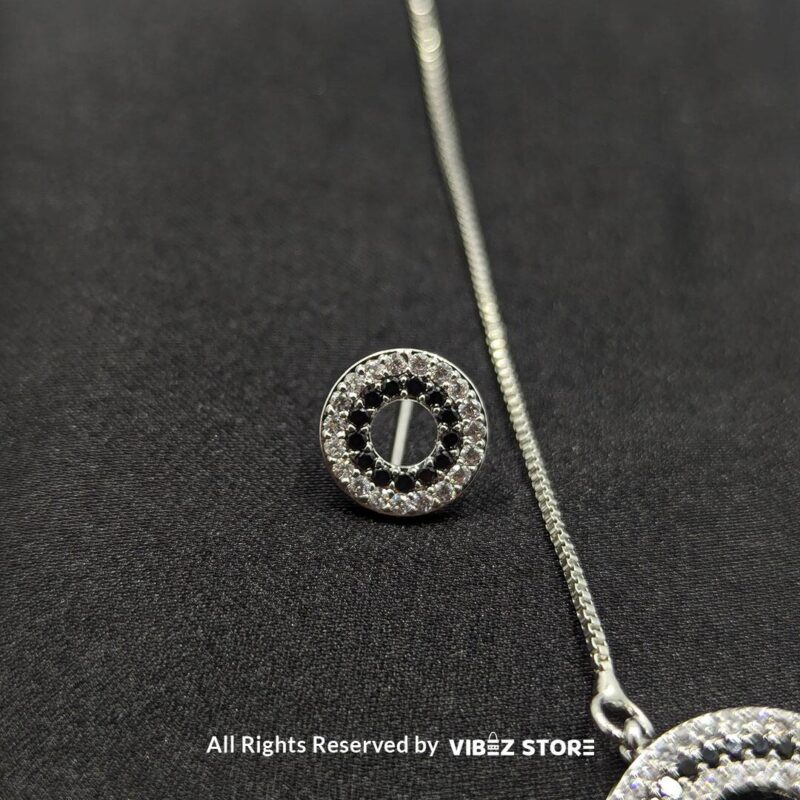 Silver Round Pendant Jewelry Set 2 Silver round pendant jewelry set with a delicate chain necklace and matching circular stud earrings, adorned with cubic zirconia stones.