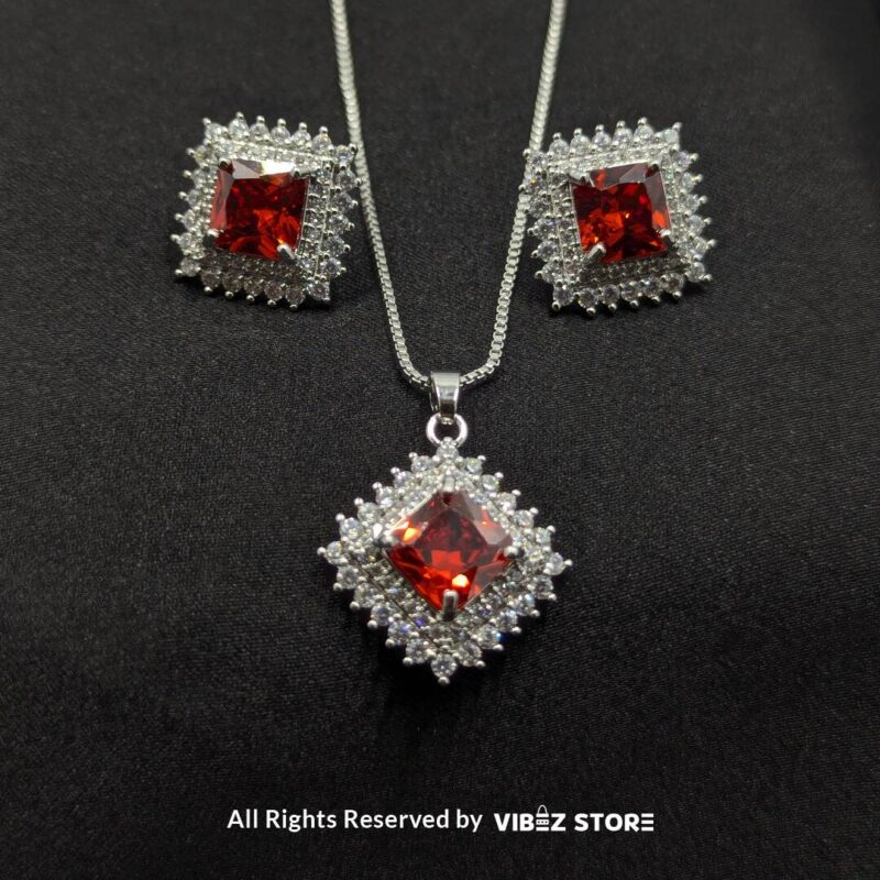 Ruby Red Square Pendant Jewelry Set 1 Ruby red square pendant jewelry set featuring a vibrant red gemstone necklace with matching stud earrings, surrounded by sparkling stones.
