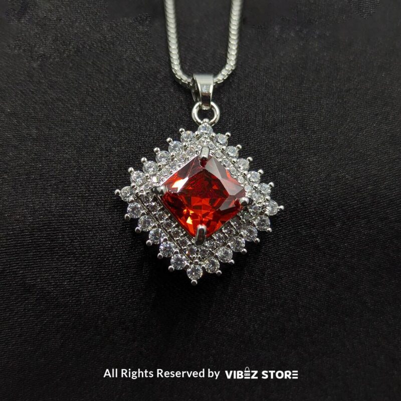 Ruby Red Square Pendant Jewelry Set 3 Ruby red square pendant jewelry set featuring a vibrant red gemstone necklace with matching stud earrings, surrounded by sparkling stones.