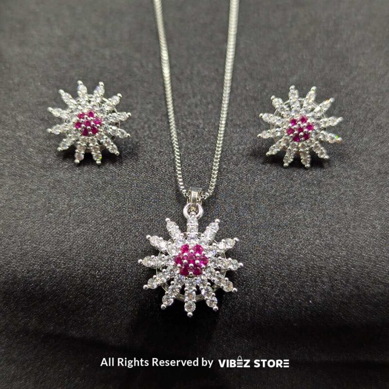 Ruby Bloom Sunflower Pendant and Earrings Set 4 Ruby sunflower jewelry set with a sparkling pendant and earrings featuring ruby-colored accents on a sleek black backdrop.
