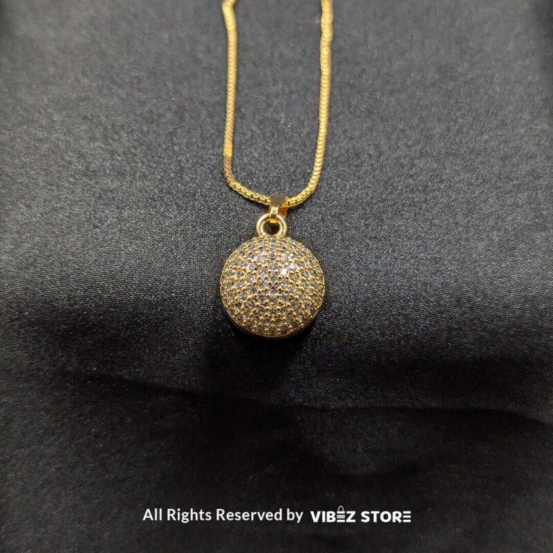 Sparkle Sphere Pendant and Earrings Set (Available in Multiple Colors) 4 Sphere-shaped pendant and earrings set featuring shimmering crystals, displayed on a sleek black backdrop. Available in multiple color variations.