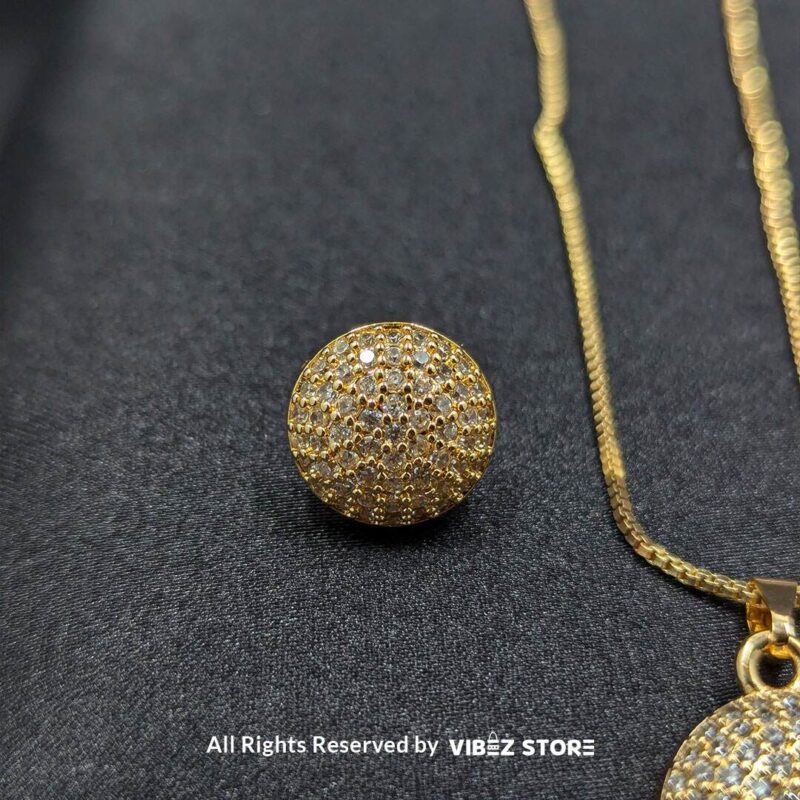 Sparkle Sphere Pendant and Earrings Set (Available in Multiple Colors) 2 Sphere-shaped pendant and earrings set featuring shimmering crystals, displayed on a sleek black backdrop. Available in multiple color variations.