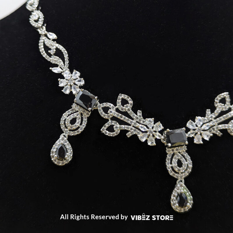 Elegant Crystal Bridal Necklace Set Silver-Tone with Earrings & Maang Tikka 3 Elegant Crystal Bridal Necklace Set with silver-tone settings, matching earrings, and maang tikka from VibezStore