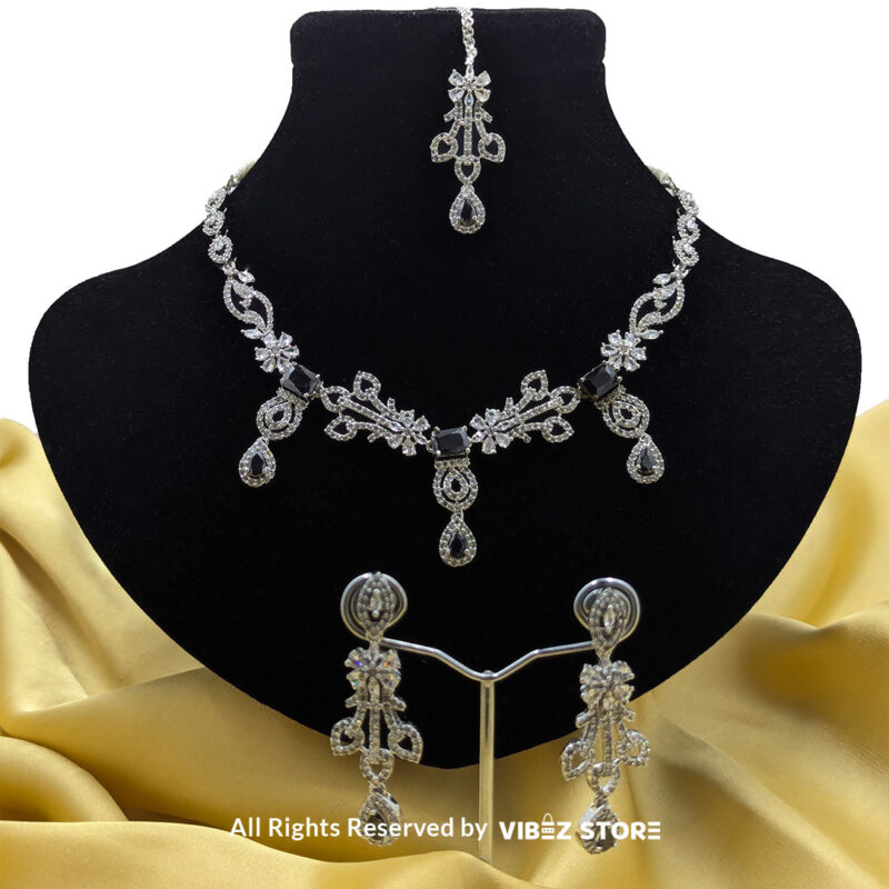 Elegant Crystal Bridal Necklace Set Silver-Tone with Earrings & Maang Tikka 5 Elegant Crystal Bridal Necklace Set with silver-tone settings, matching earrings, and maang tikka from VibezStore