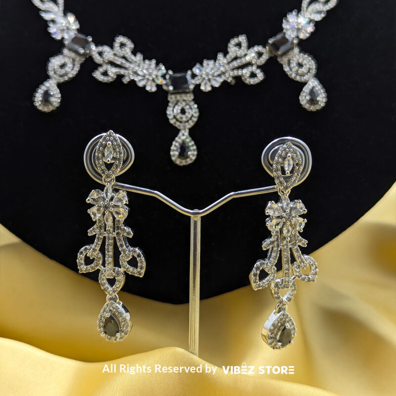 Elegant Crystal Bridal Necklace Set Silver-Tone with Earrings & Maang Tikka 6 Elegant Crystal Bridal Necklace Set with silver-tone settings, matching earrings, and maang tikka from VibezStore