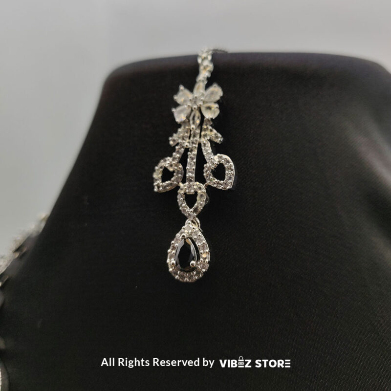 Elegant Crystal Bridal Necklace Set Silver-Tone with Earrings & Maang Tikka 7 Elegant Crystal Bridal Necklace Set with silver-tone settings, matching earrings, and maang tikka from VibezStore