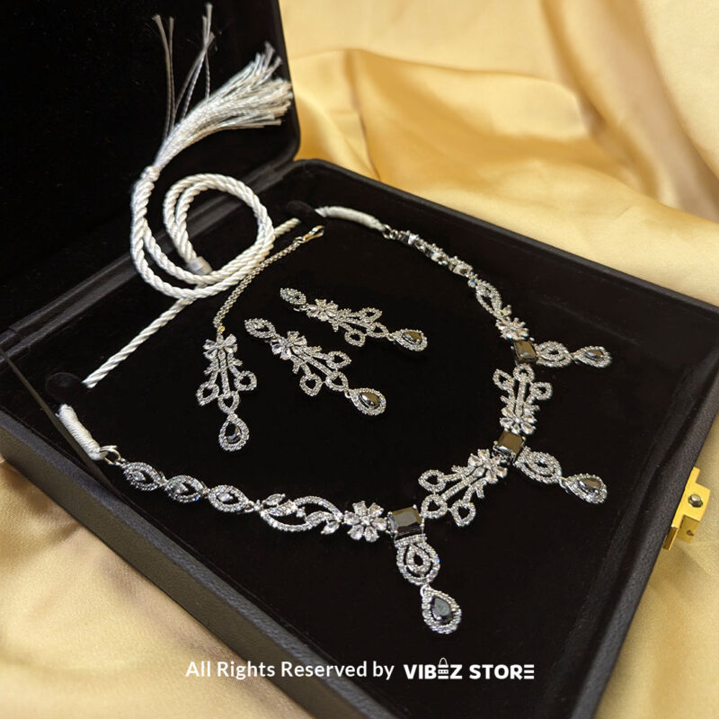 Elegant Crystal Bridal Necklace Set Silver-Tone with Earrings & Maang Tikka 2 Elegant Crystal Bridal Necklace Set with silver-tone settings, matching earrings, and maang tikka from VibezStore