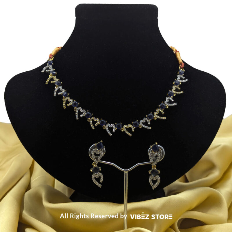 Heart & Sapphire Necklace & Earring Set Gold-Tone Crystal Jewelry 1 Heart & Sapphire Necklace and Earring Set with gold-tone settings, faux sapphire stones, and crystal heart motifs from VibezStore