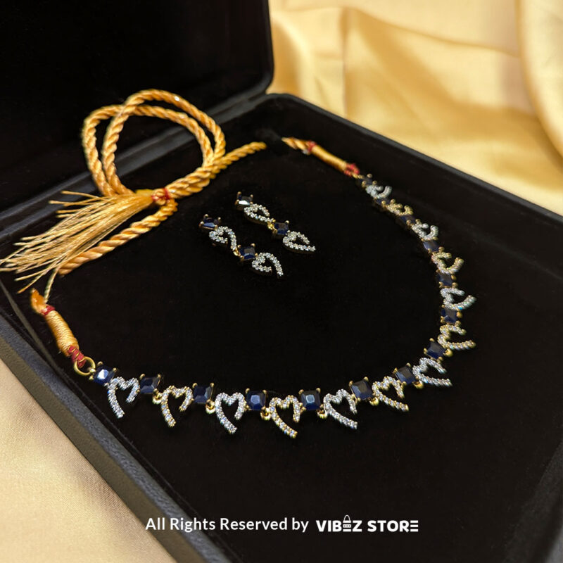 Heart & Sapphire Necklace & Earring Set Gold-Tone Crystal Jewelry 2 Heart & Sapphire Necklace and Earring Set with gold-tone settings, faux sapphire stones, and crystal heart motifs from VibezStore