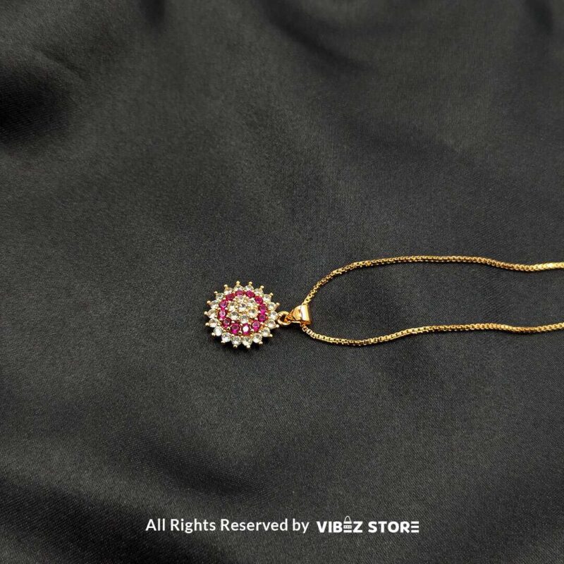 Multi-Color Gemstone Halo Lockets 5 A collection of three gemstone lockets in clear, gold-pink, and silver-pink tones, each surrounded by a dazzling crystal halo, displayed on a black fabric background.