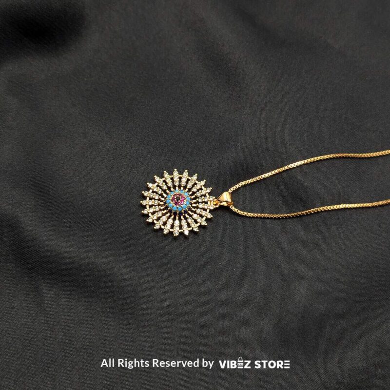 Radiant Starburst Lockets - Multi-Color Gemstone Collection 3 Three radiant starburst lockets in silver, gold, and silver-multi gemstone designs, featuring intricate crystal details, displayed on a sleek black fabric background.