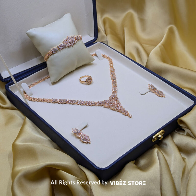 Elegant Floral Crystal Jewelry Set 2 Floral crystal jewelry set with a necklace, earrings, bracelet, and ring, elegantly displayed by Vibez Store.