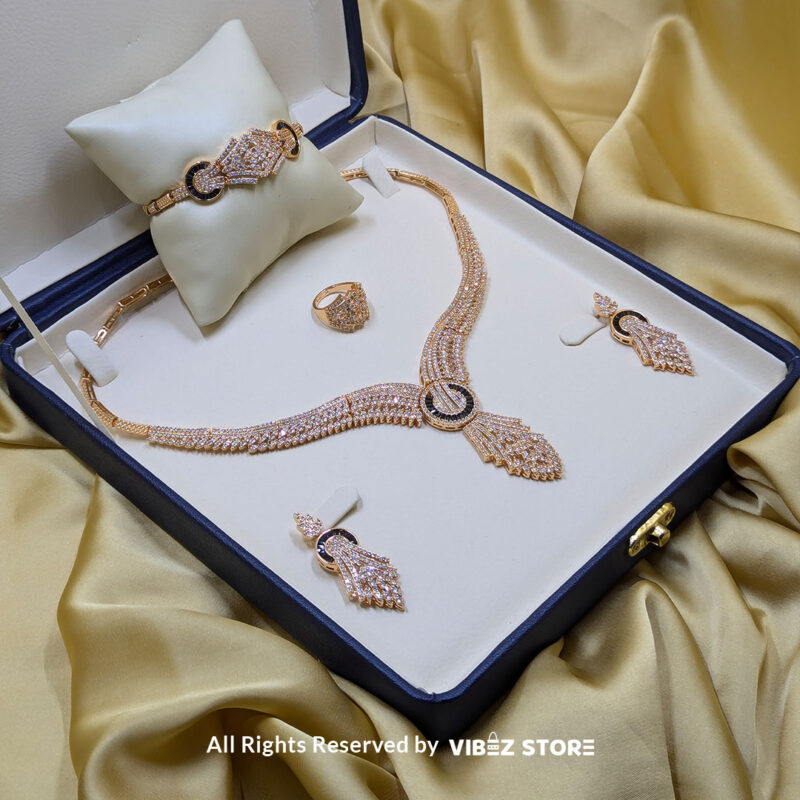 Luxurious Crystal Wings Jewelry Set 2 Crystal wings jewelry set featuring a necklace, earrings, bracelet, and ring, elegantly displayed by Vibez Store.