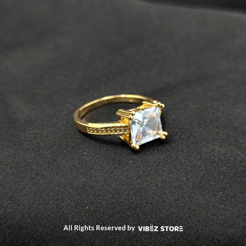 Luxurious Multi-Color Gemstone Rings (Gold-Tone) 6 Gold-tone non-adjustable rings with square gemstones in multiple colors, including rose pink, aqua blue, emerald green, ruby red, black, crystal white, and amber gold, beautifully displayed by Vibez Store.
