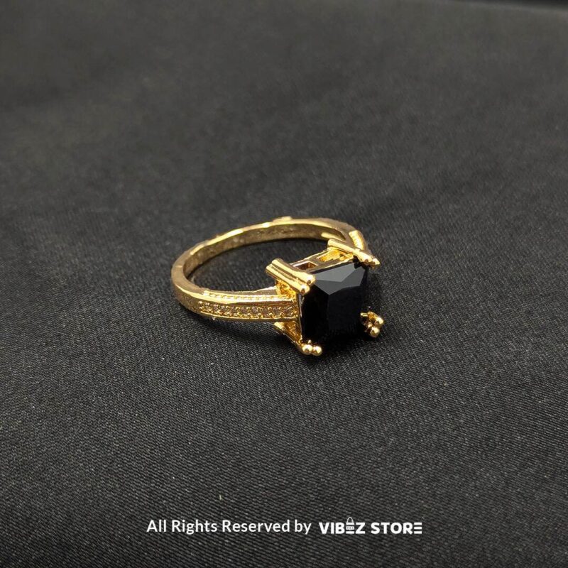 Luxurious Multi-Color Gemstone Rings (Gold-Tone) 5 Gold-tone non-adjustable rings with square gemstones in multiple colors, including rose pink, aqua blue, emerald green, ruby red, black, crystal white, and amber gold, beautifully displayed by Vibez Store.
