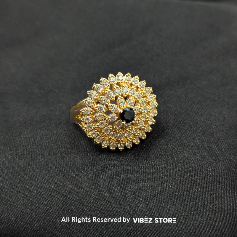 Radiant Floral Crystal Rings 4 Gold-tone floral rings with crystal accents and central gemstones in jet black, ruby red, and champagne gold, beautifully displayed by Vibez Store.