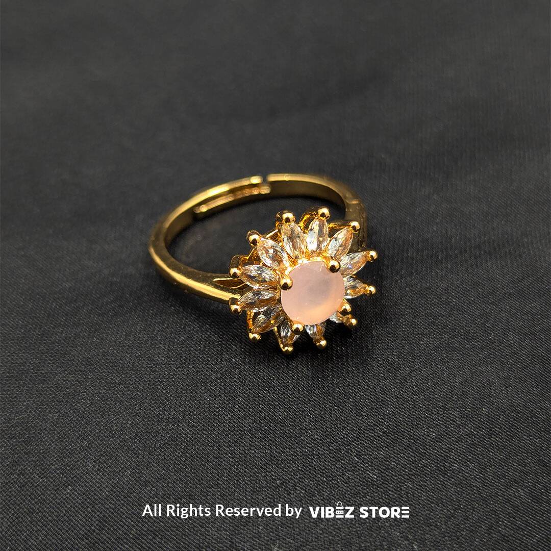 RNG-18 Golden Sunburst Ring with Pink Center Stone - Image 1
