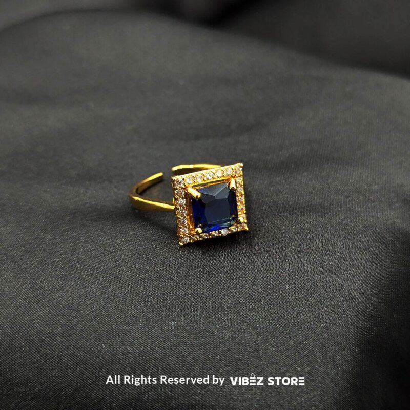 Elegant Square Gemstone Rings (Adjustable, Color Variations Available) 4 Gold-tone adjustable rings with square gemstones in rose pink, aqua blue, and sapphire variations, elegantly displayed by Vibez Store.
