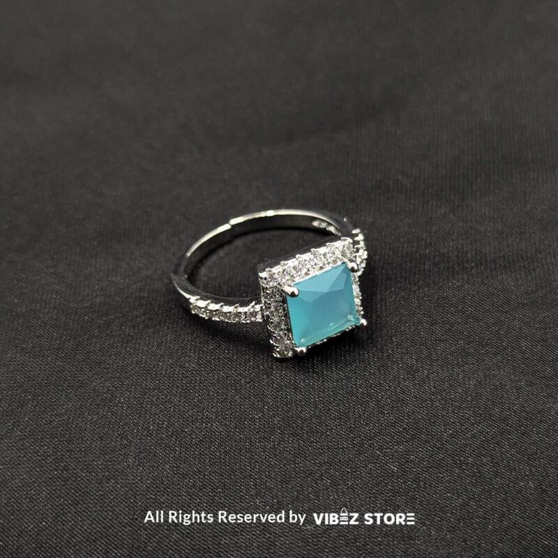 Sophisticated Square Gemstone Rings (Silver-Tone, Adjustable) 3 Silver-tone adjustable rings with square gemstones in aqua blue, rose pink, and emerald green, elegantly displayed by Vibez Store.