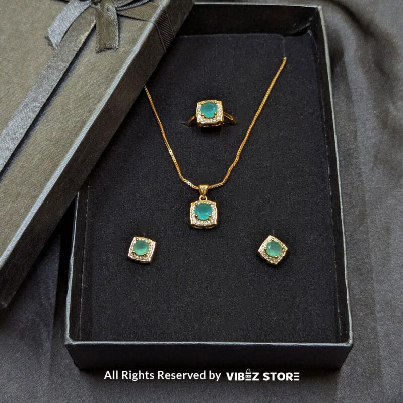 Aqua Radiance Jewelry Set – Necklace, Earrings, and Ring 1 Aqua Radiance Jewelry Set featuring an aqua gemstone necklace, earrings, and ring with crystal accents and a gold-tone finish – Vibez Store.
