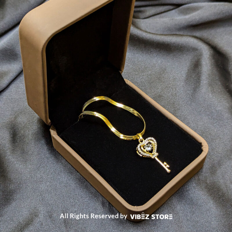 Gold Heart Key Pendant Necklace 3 Gold Heart Key Pendant Necklace with a sparkling crystal centerpiece on a sleek gold chain – Vibez Store.