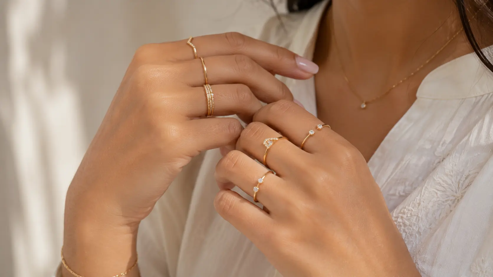 Minimal Jewellery Trends in Pakistan for Girls in 2026 4 Thin band rings and minimal ring stacks styled elegantly on female hands in natural light