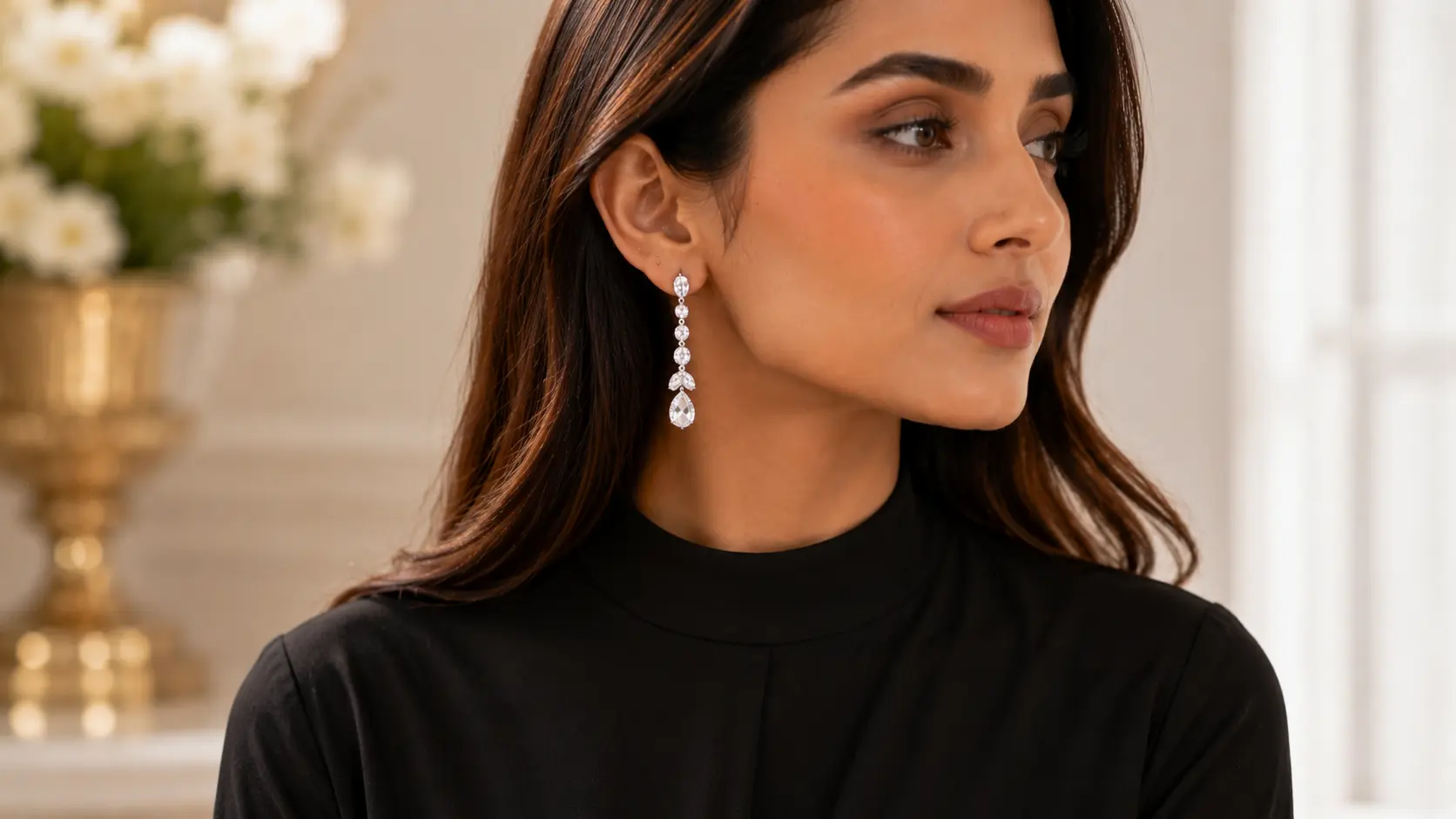 Jhumka Earrings vs Drop Earrings: Which Style Should You Choose? 3 Woman wearing sleek modern drop earrings styled with contemporary fashion outfit
