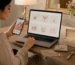 Woman checking jewellery quality and sizing while shopping online for jewellery in Pakistan