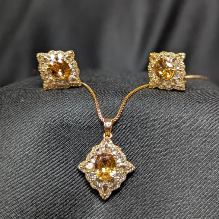 Champagne gold necklace earrings set with sparkling zircon style stones and gold tone finish