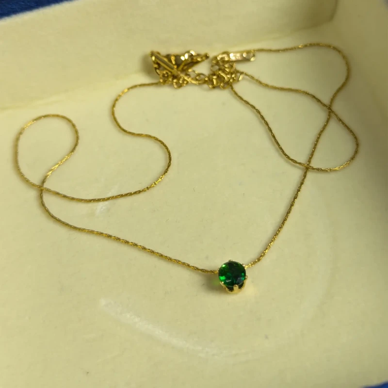 Emerald Green Gold Solitaire Pendant Necklace for Women 3 Gold pendant necklace with emerald green stone and clasp chain detail