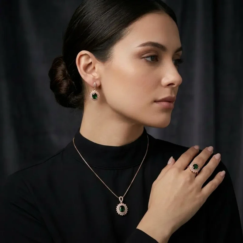 Emerald Green Zircon Jewellery Set with Earrings, Pendant & Ring 1 Model wearing emerald green jewellery set with matching earrings pendant necklace and ring