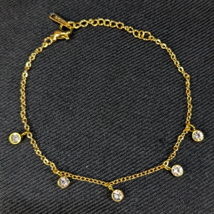 Gold crystal charm bracelet with round clear hanging stones and adjustable clasp