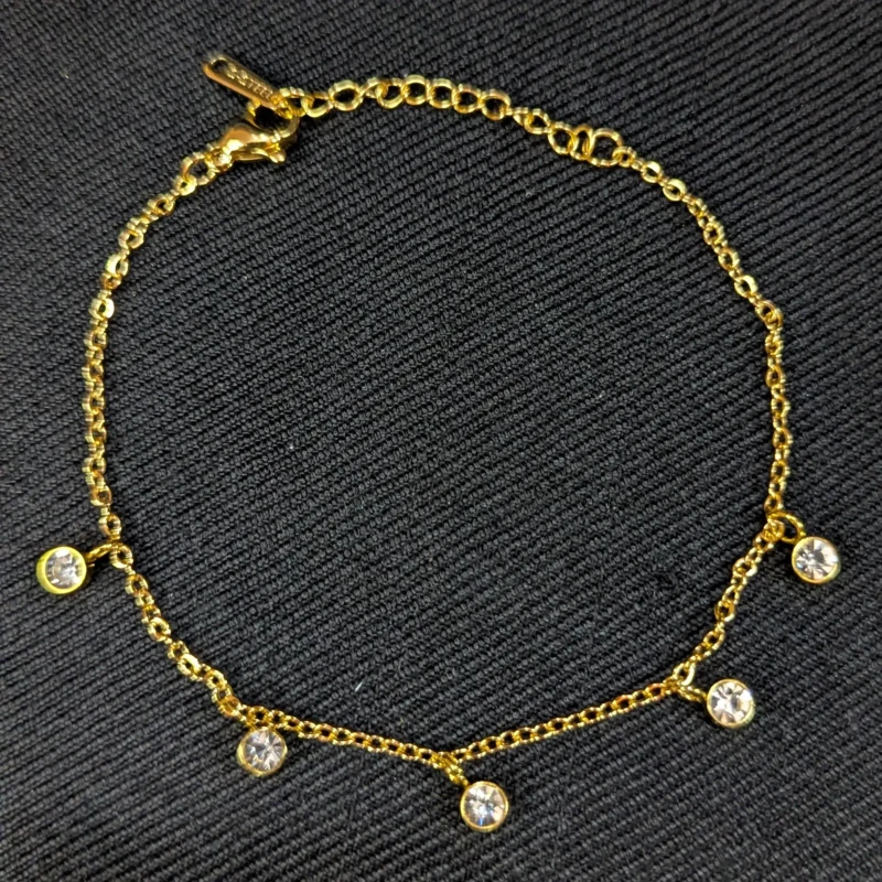 Gold Crystal Charm Bracelet for Women 2 Gold crystal charm bracelet with round clear hanging stones and adjustable clasp