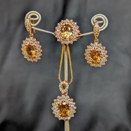 Golden yellow jewellery set with matching earrings pendant necklace and ring
