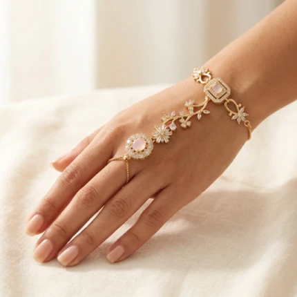 Model wearing blush pink gold hathphool bracelet on hand with elegant outfit