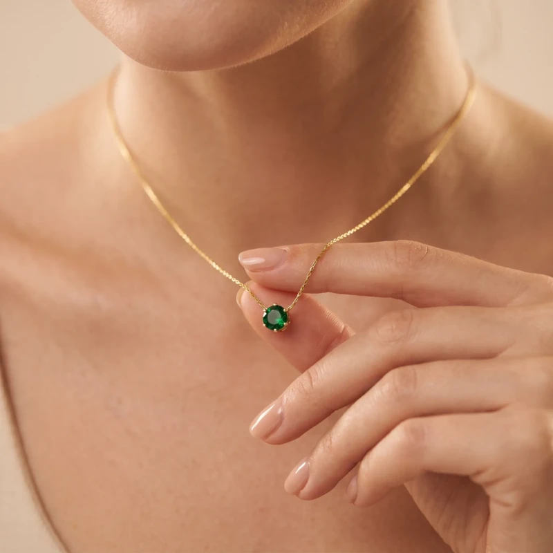 Emerald Green Gold Solitaire Pendant Necklace for Women 1 Model wearing emerald green gold solitaire pendant necklace