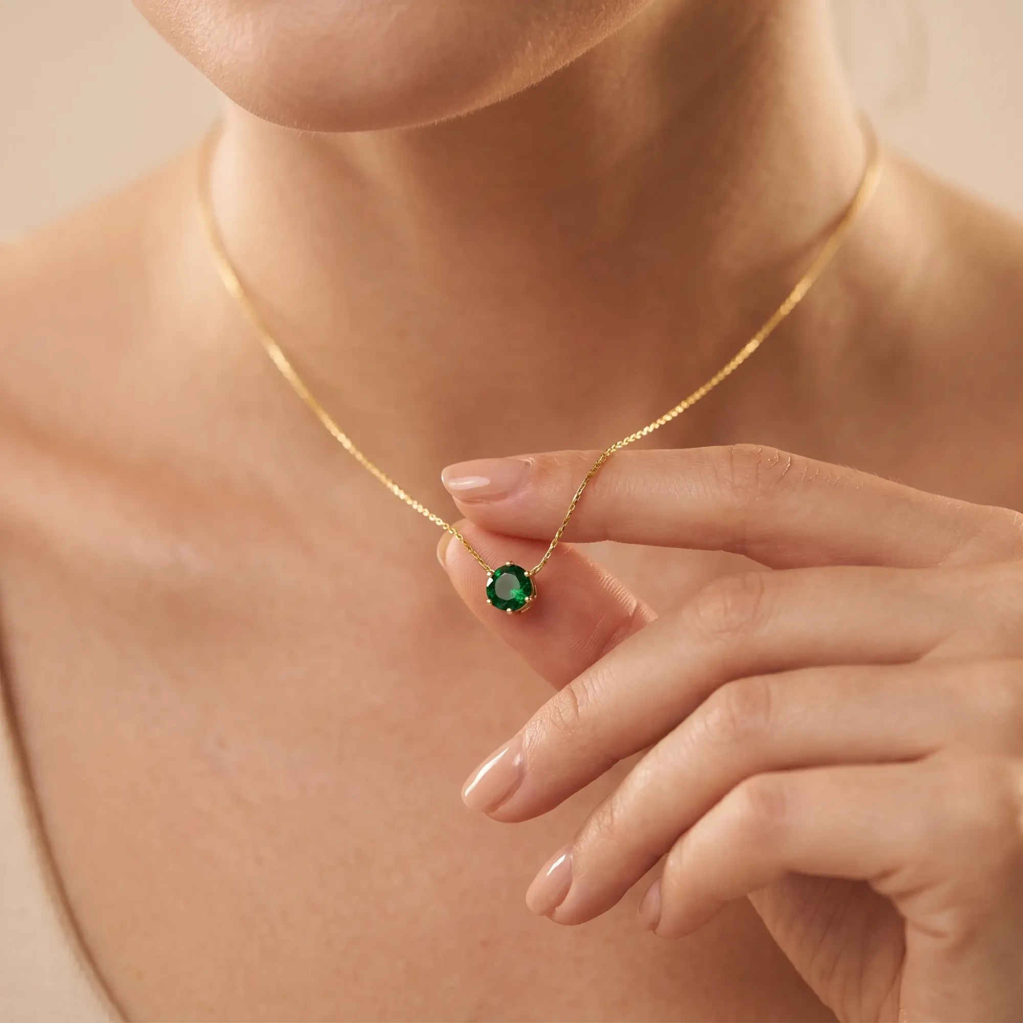 Model Wearing Emerald Green Gold Pendant Necklace Model wearing emerald green gold solitaire pendant necklace