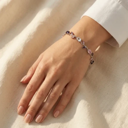 Model wearing pink purple silver vine bracelet on wrist