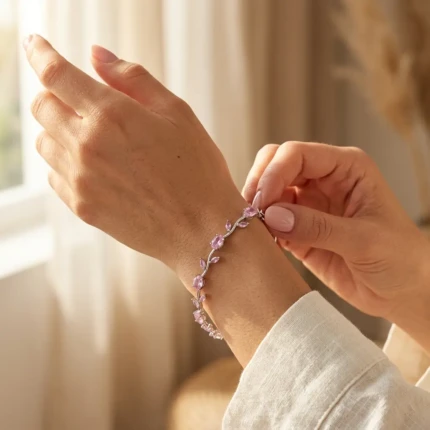 Model wearing pink stone silver vine bracelet on wrist
