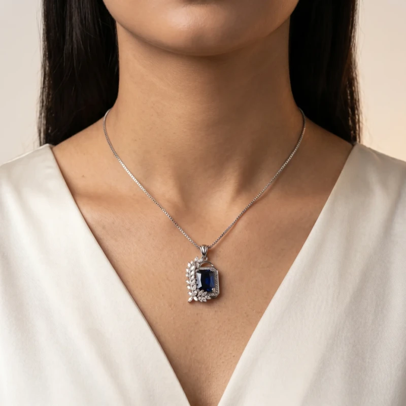 Silver Blue Stone Pendant Necklace for Women 1 Model wearing silver blue stone pendant necklace with white outfit