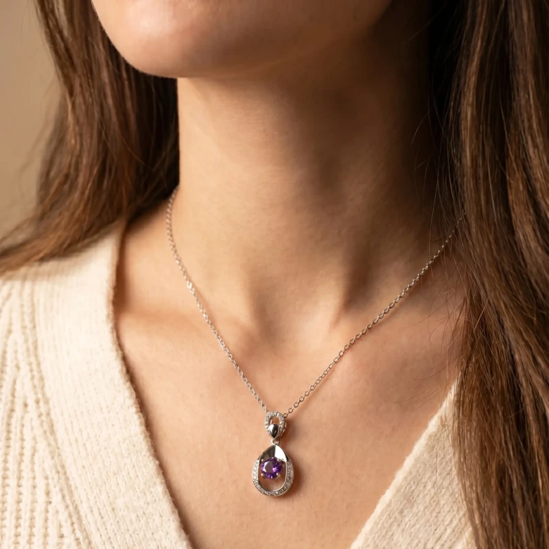 Silver Purple Stone Teardrop Pendant Necklace for Women 1 Model wearing silver purple stone pendant necklace with cream sweater
