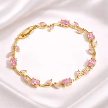 Pink stone gold vine bracelet with leaf design and clasp closure