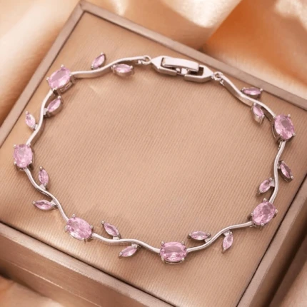 Pink stone silver vine bracelet with leaf design and clasp closure